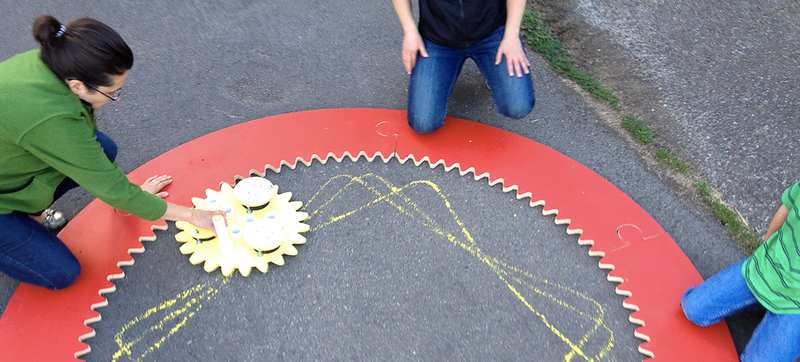 Illustration for article titled Guy Builds Giant Spirograph, Takes Chalk Art To the Next Level